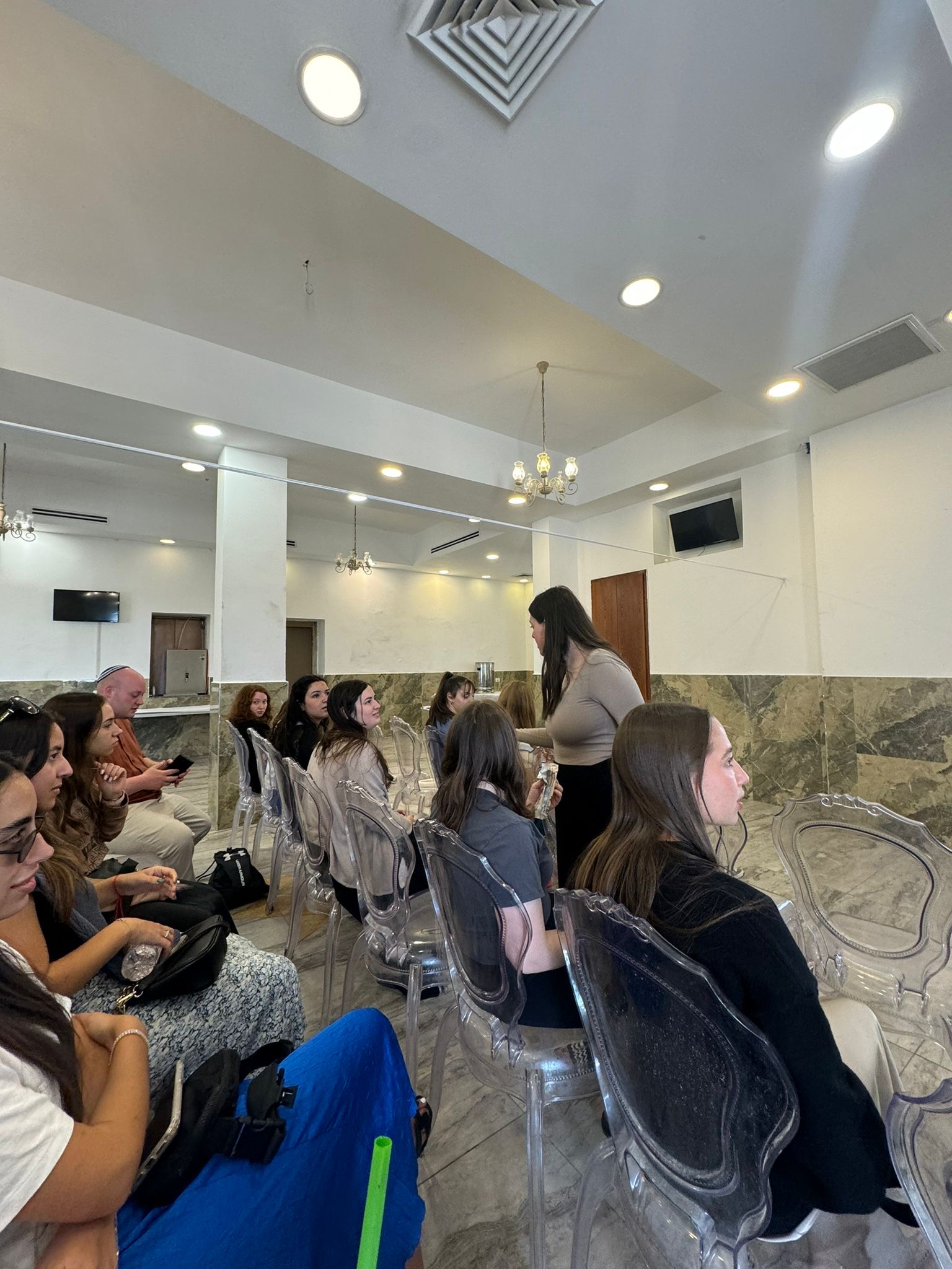 Akiva participants listening during a group session